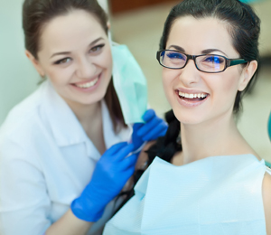 Dentist with happy patient